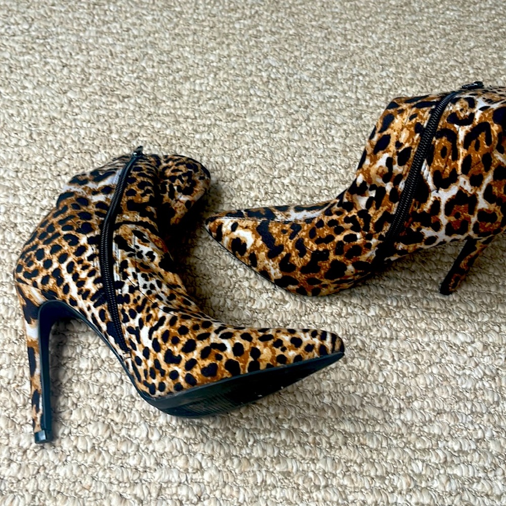 Animal print booties. 4.5 inch heel. Stretchy, soft fabric material. EUC.